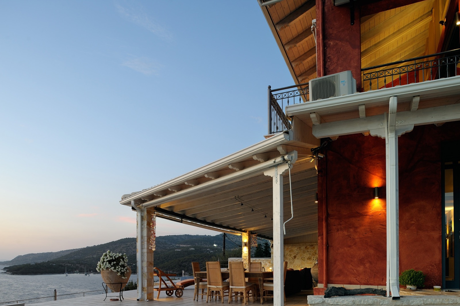 Pergola dining at sunset over the Ionian Sea
